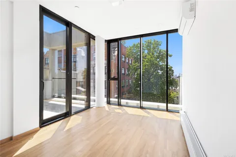 a view of an empty room with glass door