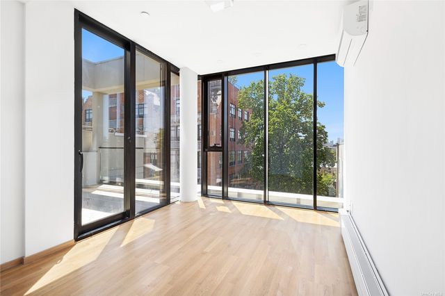a view of an empty room with glass door
