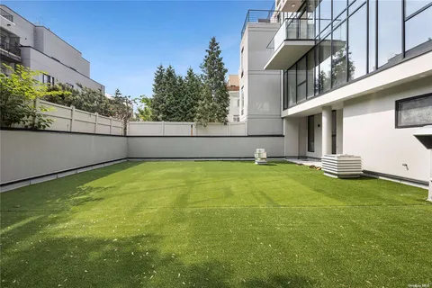 a view of a balcony with an outdoor seating