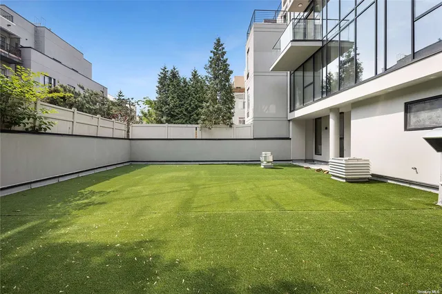 a view of a balcony with an outdoor seating