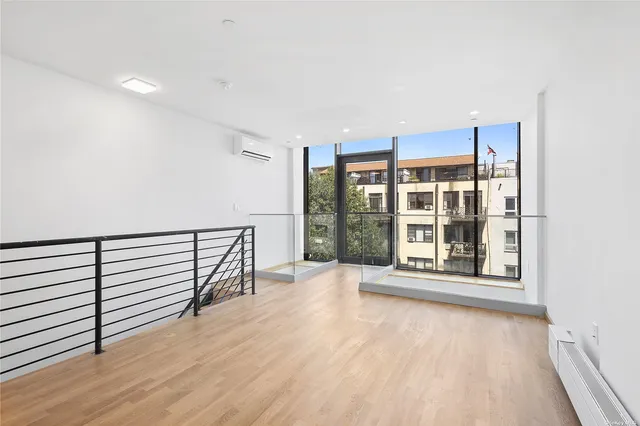 a kitchen with granite countertop white cabinets and stainless steel appliances