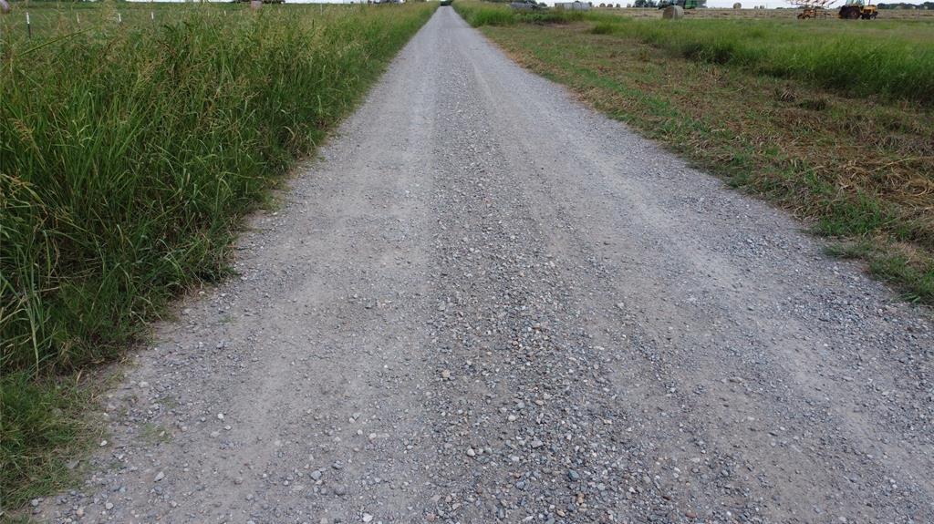 720 County Road 2105 Cooper, TX 75432 - Photo 5 of 6 a view of a road with a yard