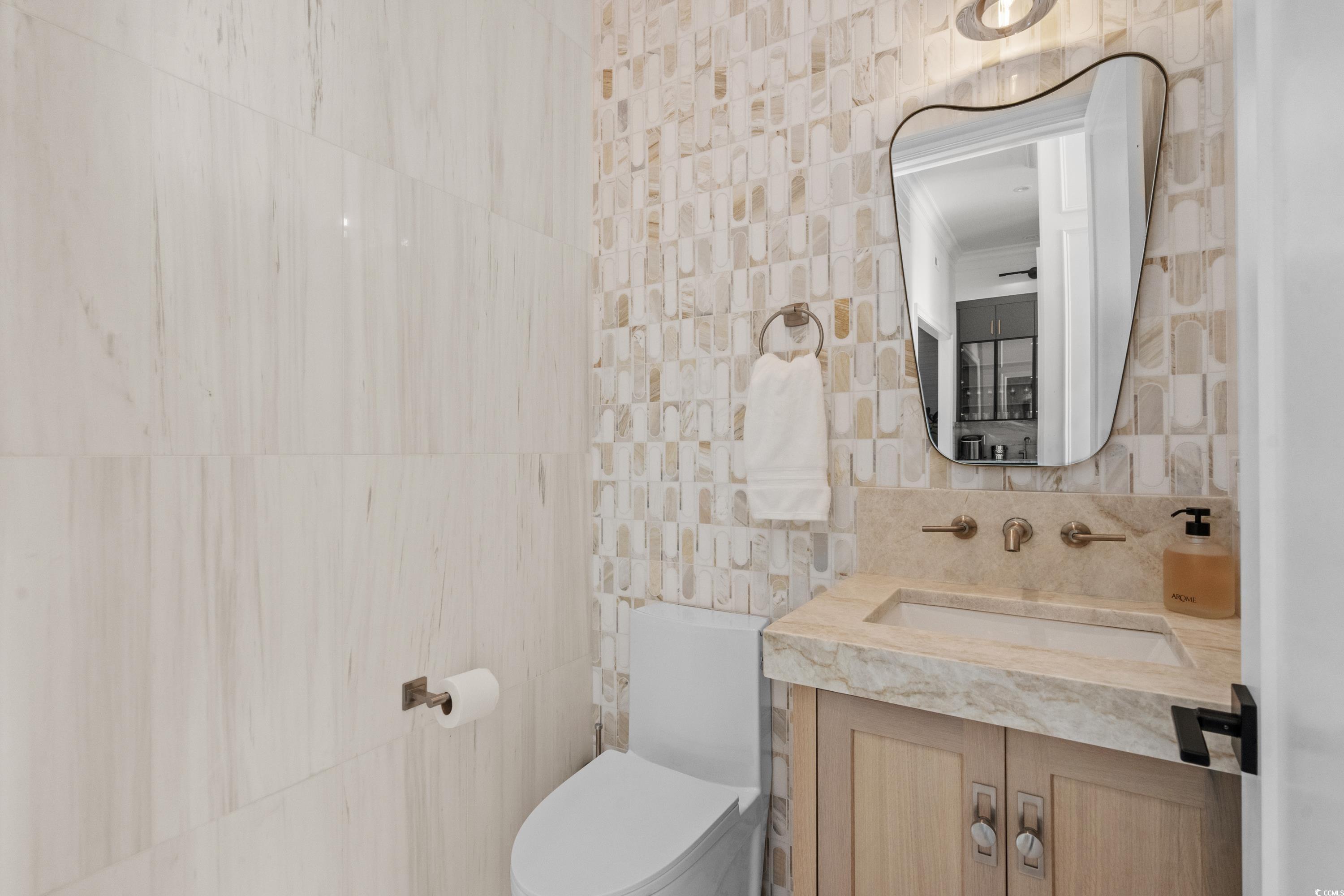 3109 State Rd S-26-816 Murrells Inlet, SC 29576 - Photo 13 of 40 Bathroom with vanity, tile walls, and toilet