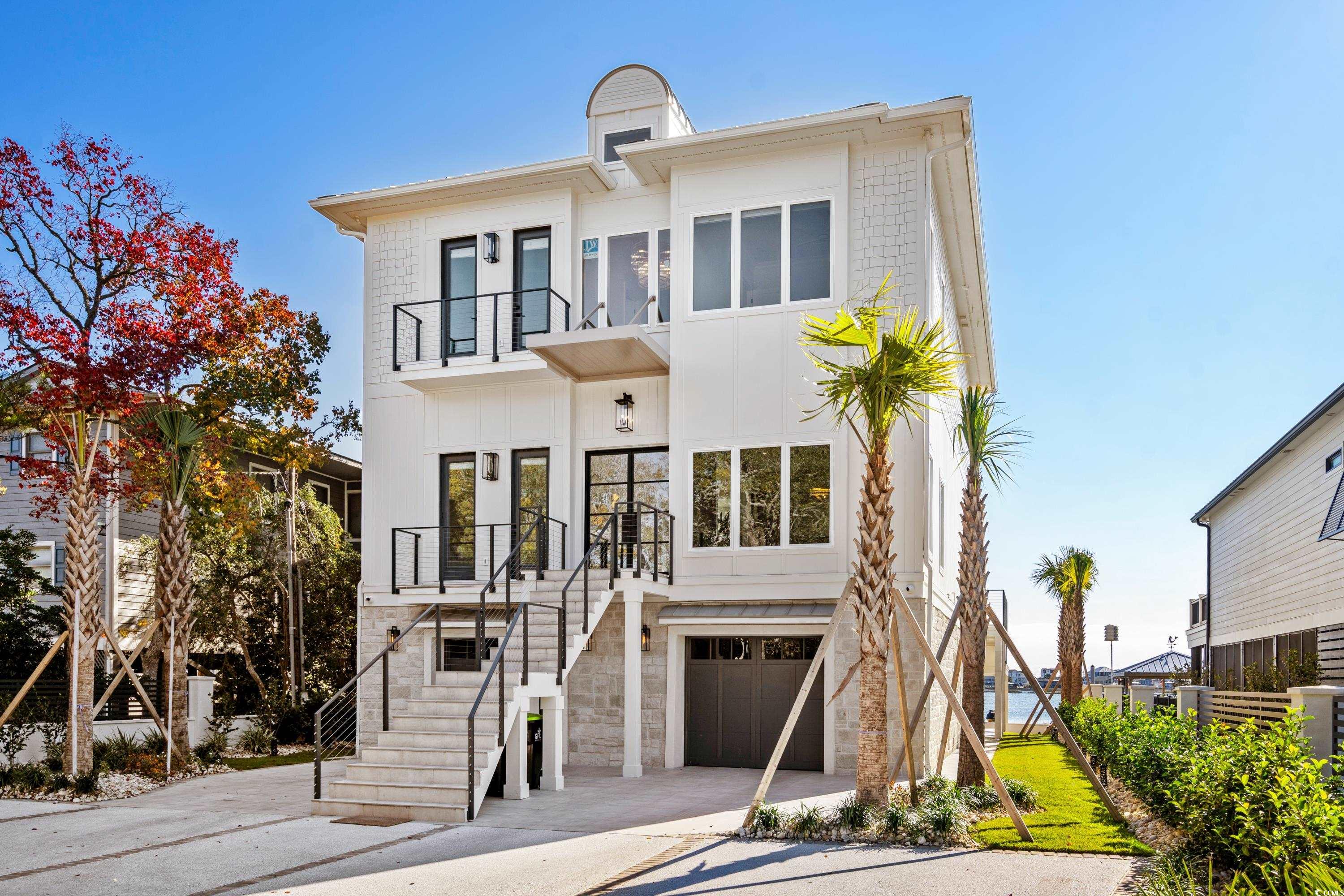 3109 State Rd S-26-816 Murrells Inlet, SC 29576 - Photo 2 of 40 View of front of house featuring a balcony and a garage