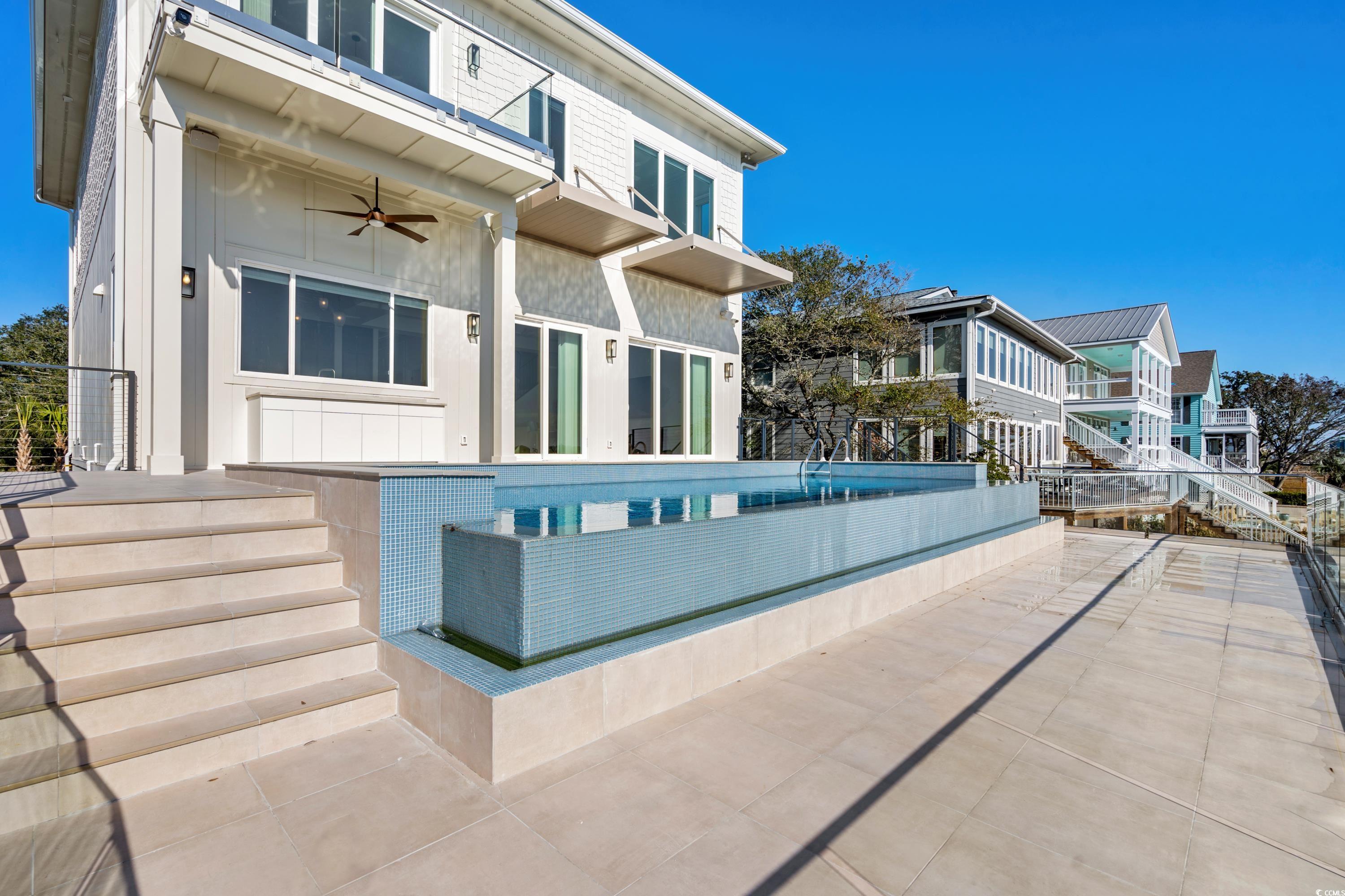 3109 State Rd S-26-816 Murrells Inlet, SC 29576 - Photo 23 of 40 View of swimming pool featuring a patio and ceiling fan