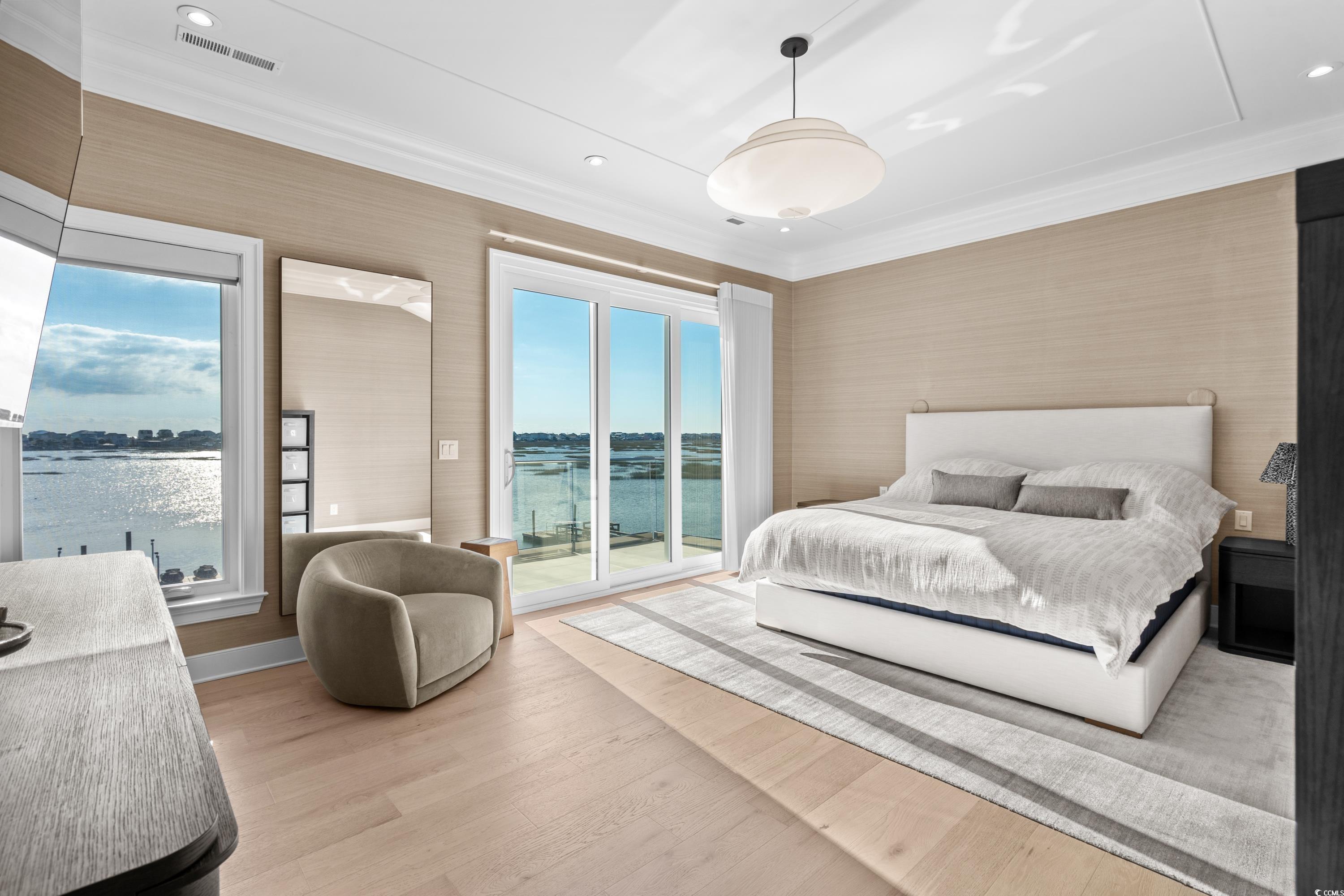 3109 State Rd S-26-816 Murrells Inlet, SC 29576 - Photo 25 of 40 Bedroom with a water view, light hardwood / wood-style flooring, access to outside, and multiple windows