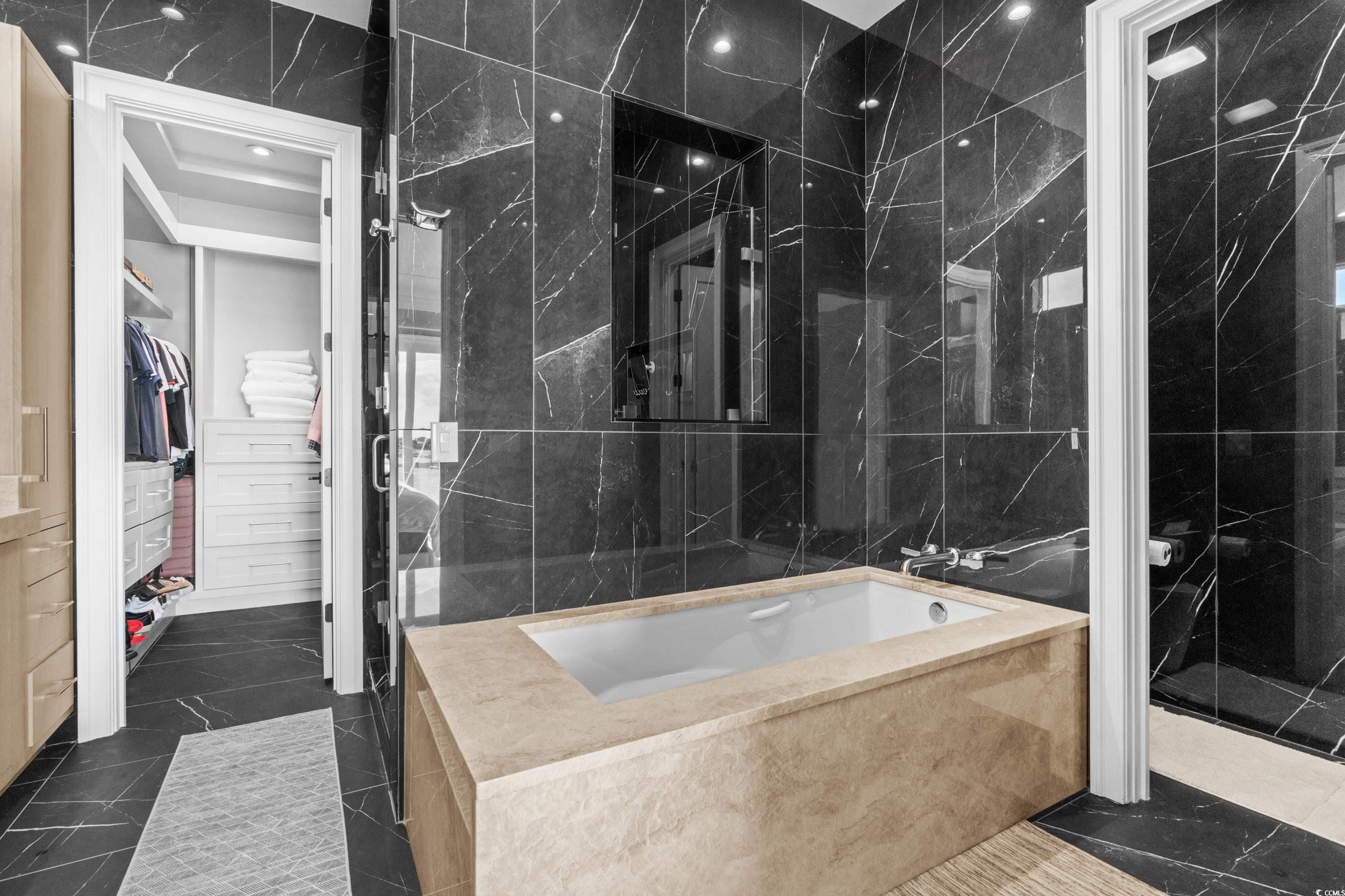 3109 State Rd S-26-816 Murrells Inlet, SC 29576 - Photo 28 of 40 Bathroom featuring separate shower and tub and tile walls