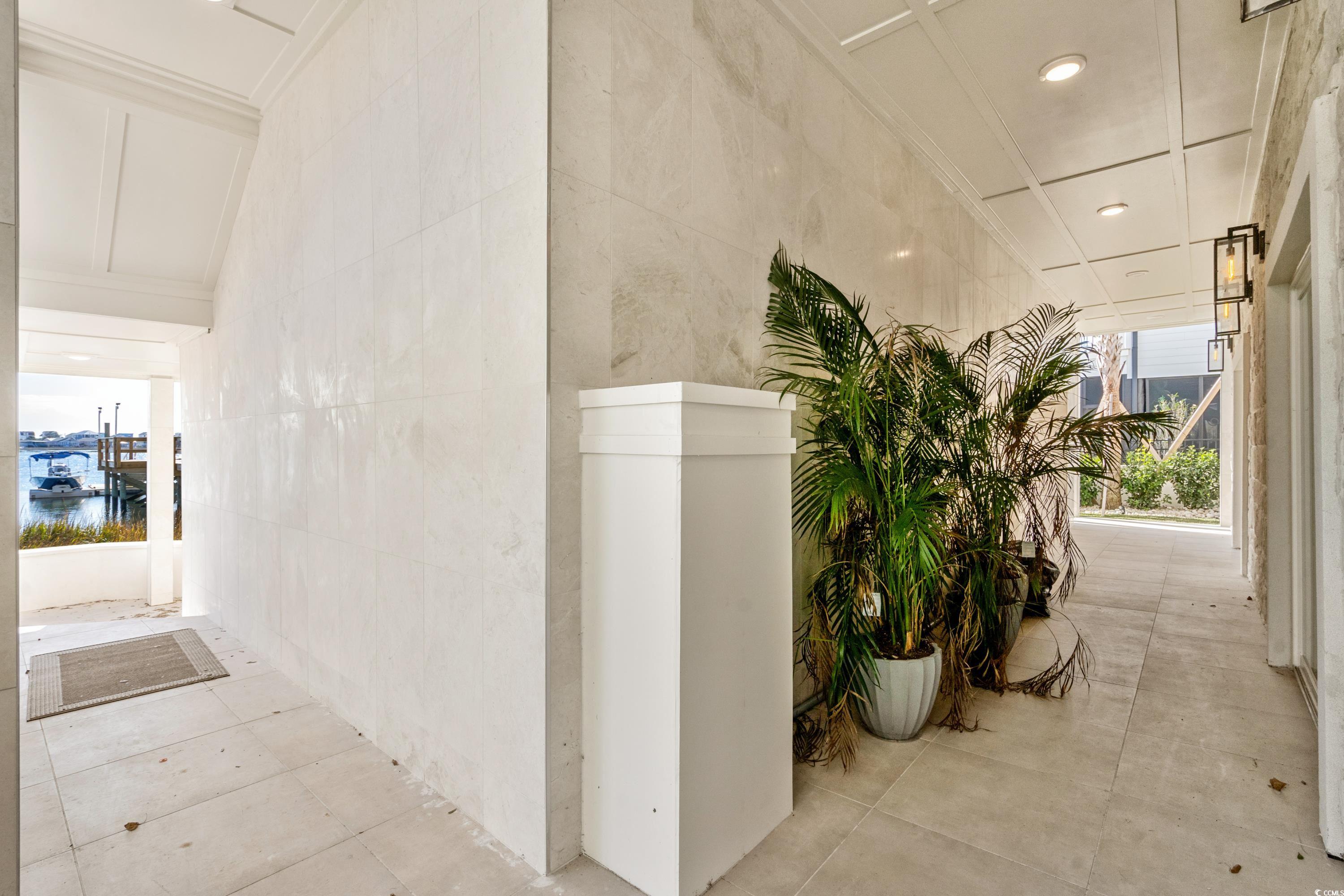 3109 State Rd S-26-816 Murrells Inlet, SC 29576 - Photo 40 of 40 Hallway with a water view and tile walls