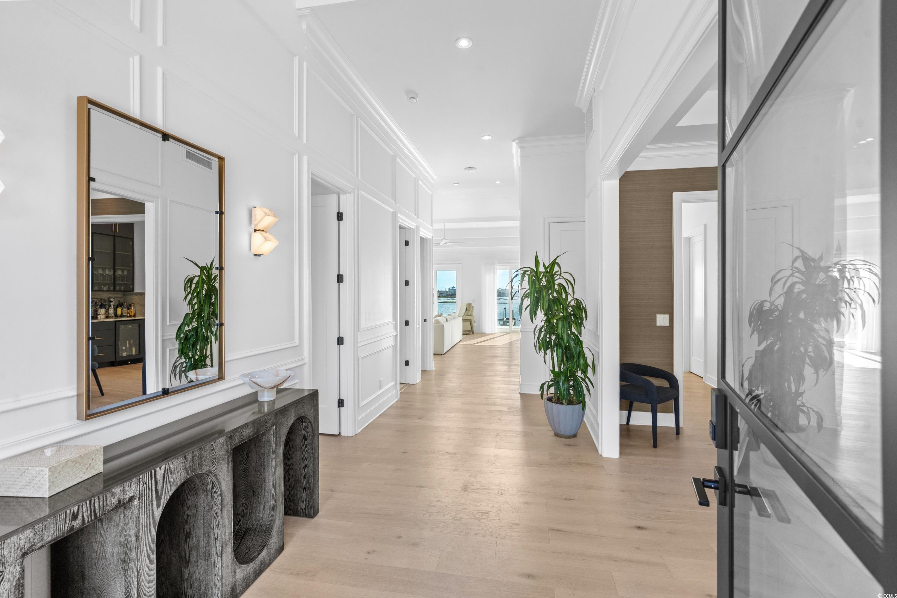 3109 State Rd S-26-816 Murrells Inlet, SC 29576 - Photo 9 of 40 Hall with light hardwood / wood-style floors and crown molding