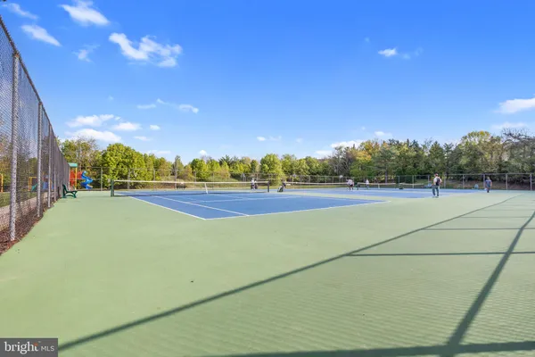 a view of an outdoor space and tennis court