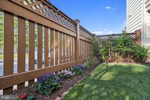 a couple of flower plants in front of house