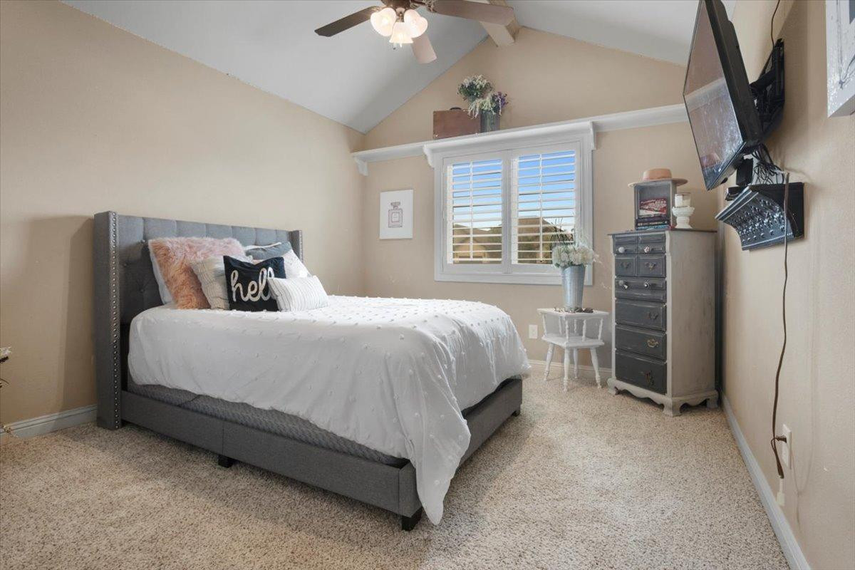 1125 17th Street Shallowater, TX 79363 - Photo 20 of 32 a bed room with a bed and a window