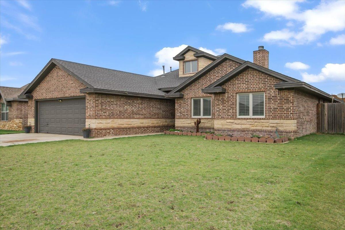 1125 17th Street Shallowater, TX 79363 - Photo 2 of 32 a front view of a house with a garden