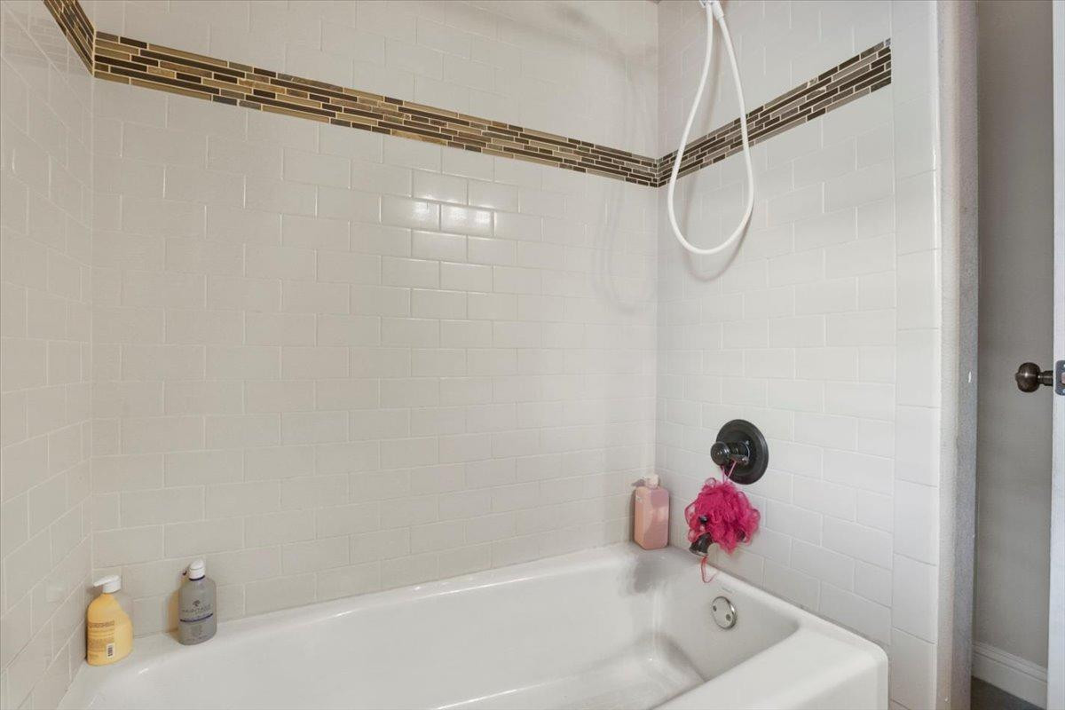 1125 17th Street Shallowater, TX 79363 - Photo 23 of 32 a bathroom with a shower and a shower