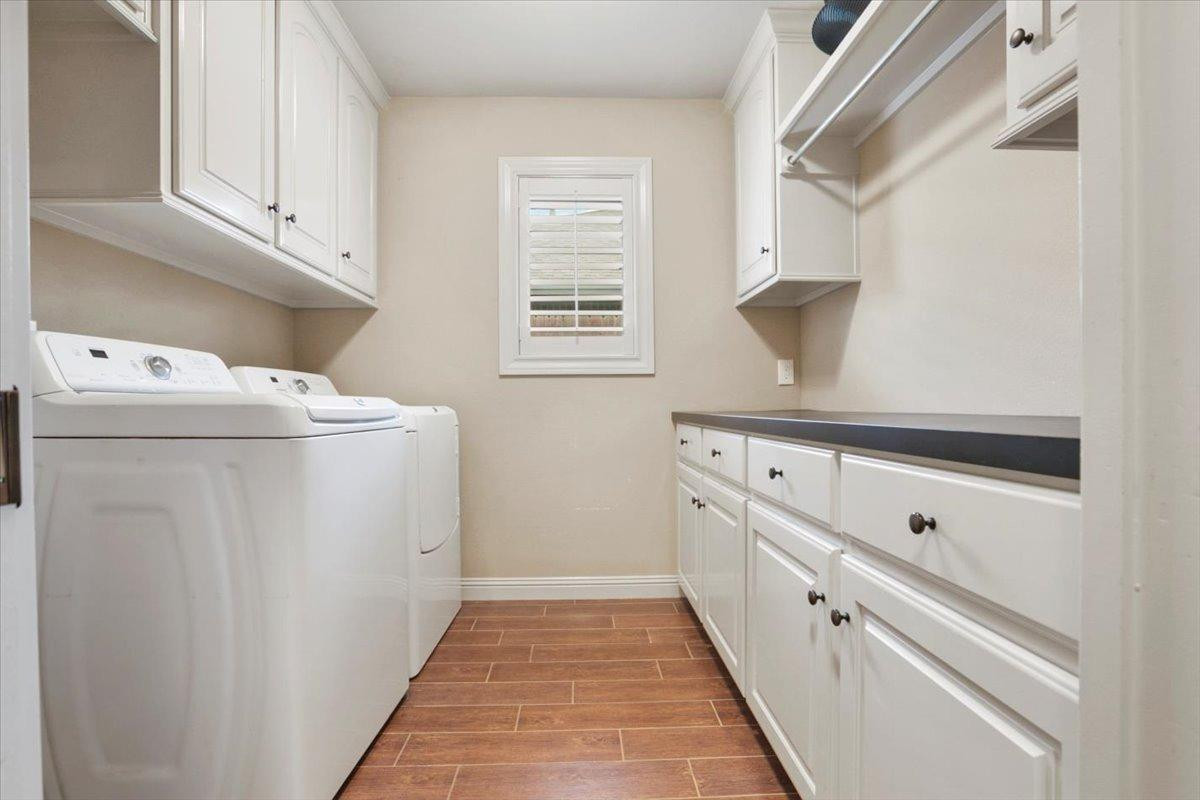 1125 17th Street Shallowater, TX 79363 - Photo 25 of 32 a kitchen with white cabinets and white appliances