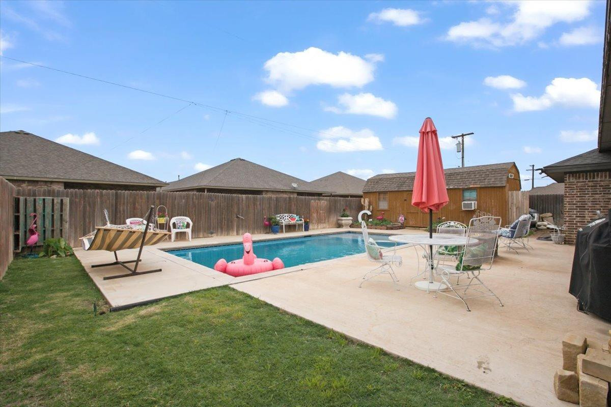 1125 17th Street Shallowater, TX 79363 - Photo 31 of 32 a view of a patio with a table and chairs