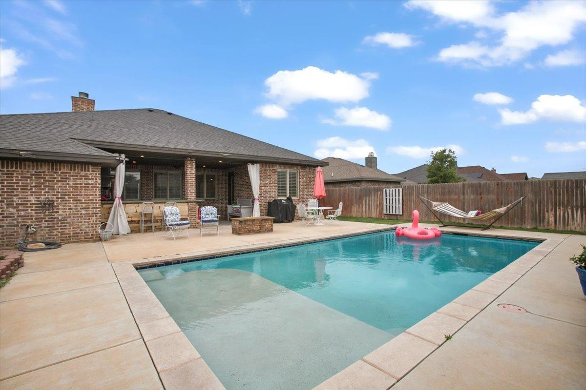 1125 17th Street Shallowater, TX 79363 - Photo 32 of 32 a view of a house with swimming pool and sitting area