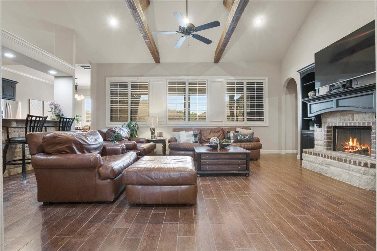 1125 17th Street Shallowater, TX 79363 - Photo 5 of 32 a living room with furniture fireplace and flat screen tv