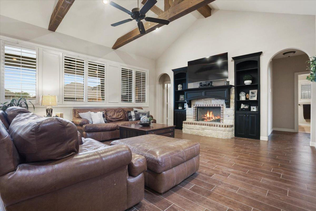 1125 17th Street Shallowater, TX 79363 - Photo 6 of 32 a living room with furniture window and a fireplace