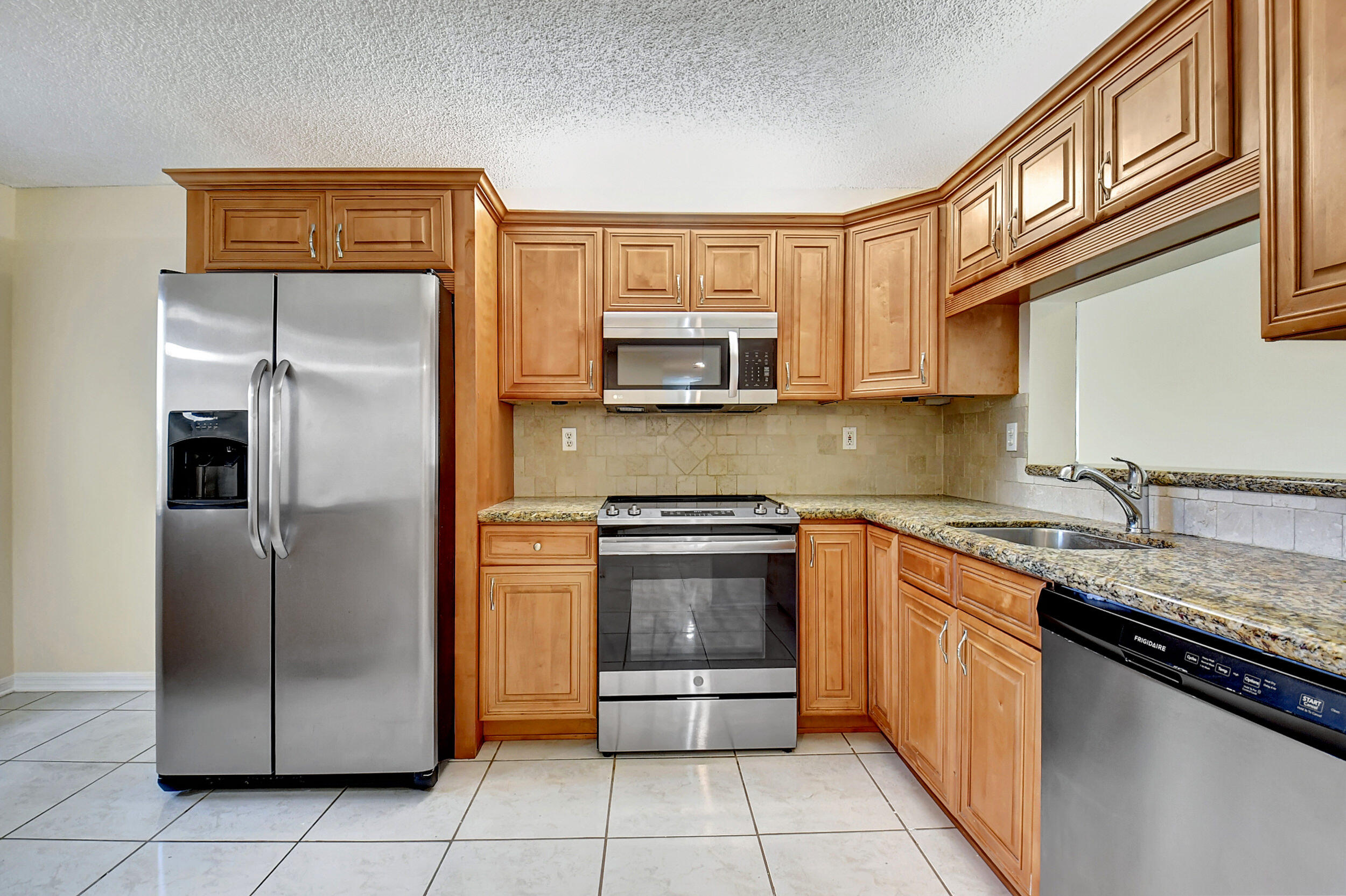 440 Northwest 67th Street, Unit H102 Boca Raton, FL 33487 - Photo 2 of 34 Kitchen