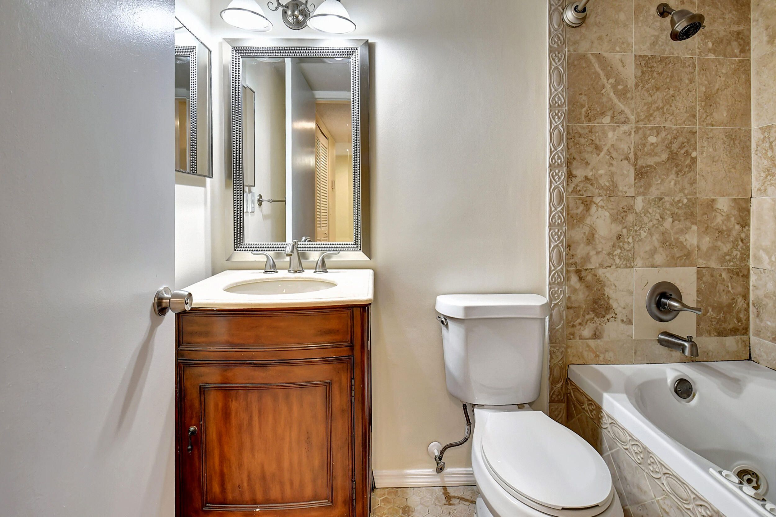 440 Northwest 67th Street, Unit H102 Boca Raton, FL 33487 - Photo 22 of 34 Guest Bathroom