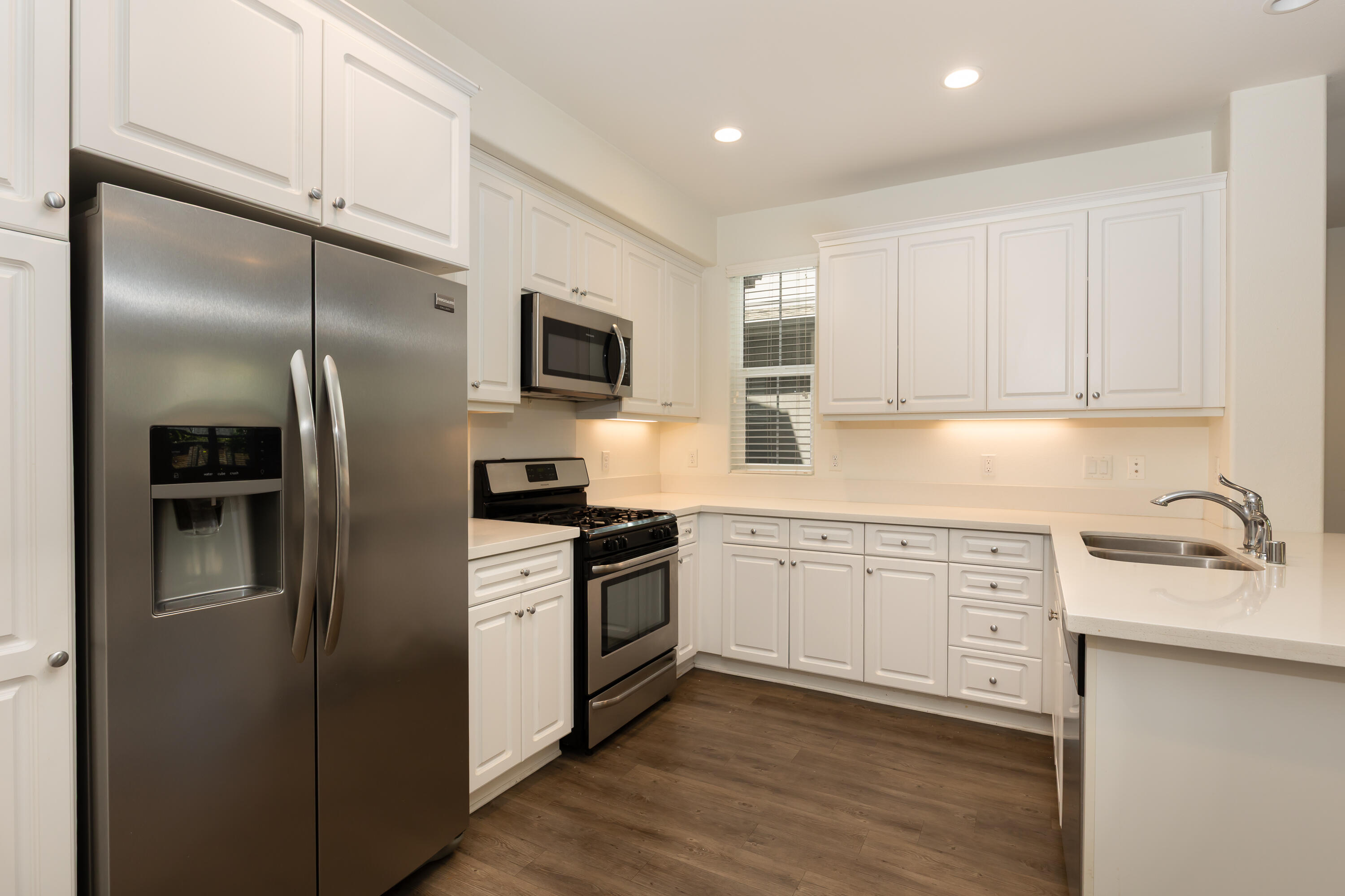 243 Deming Way Buellton, CA 93427 - Photo 1 of 28 a kitchen with a refrigerator stove and sink