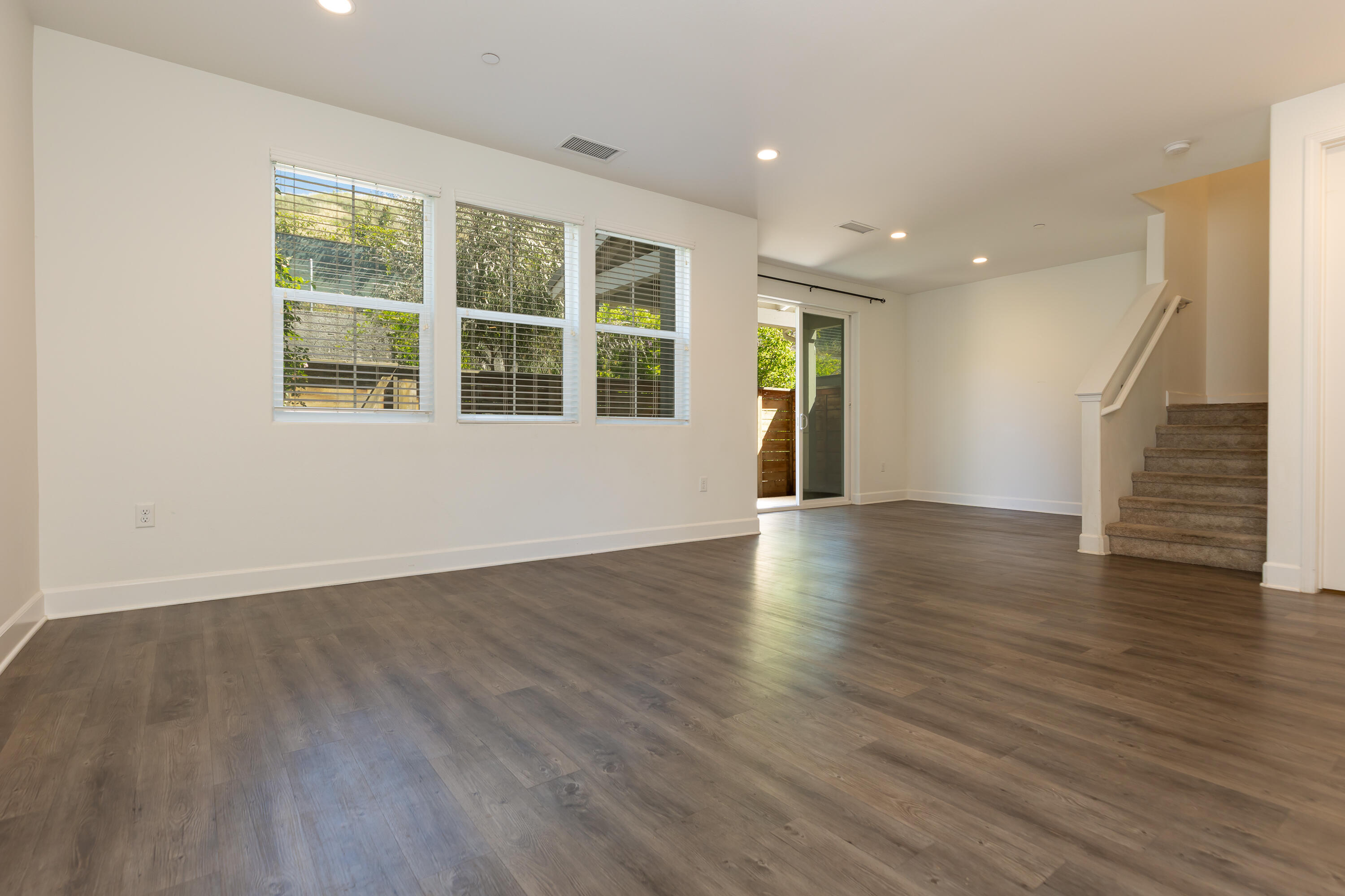 243 Deming Way Buellton, CA 93427 - Photo 3 of 28 a view of an empty room with wooden floor and a window