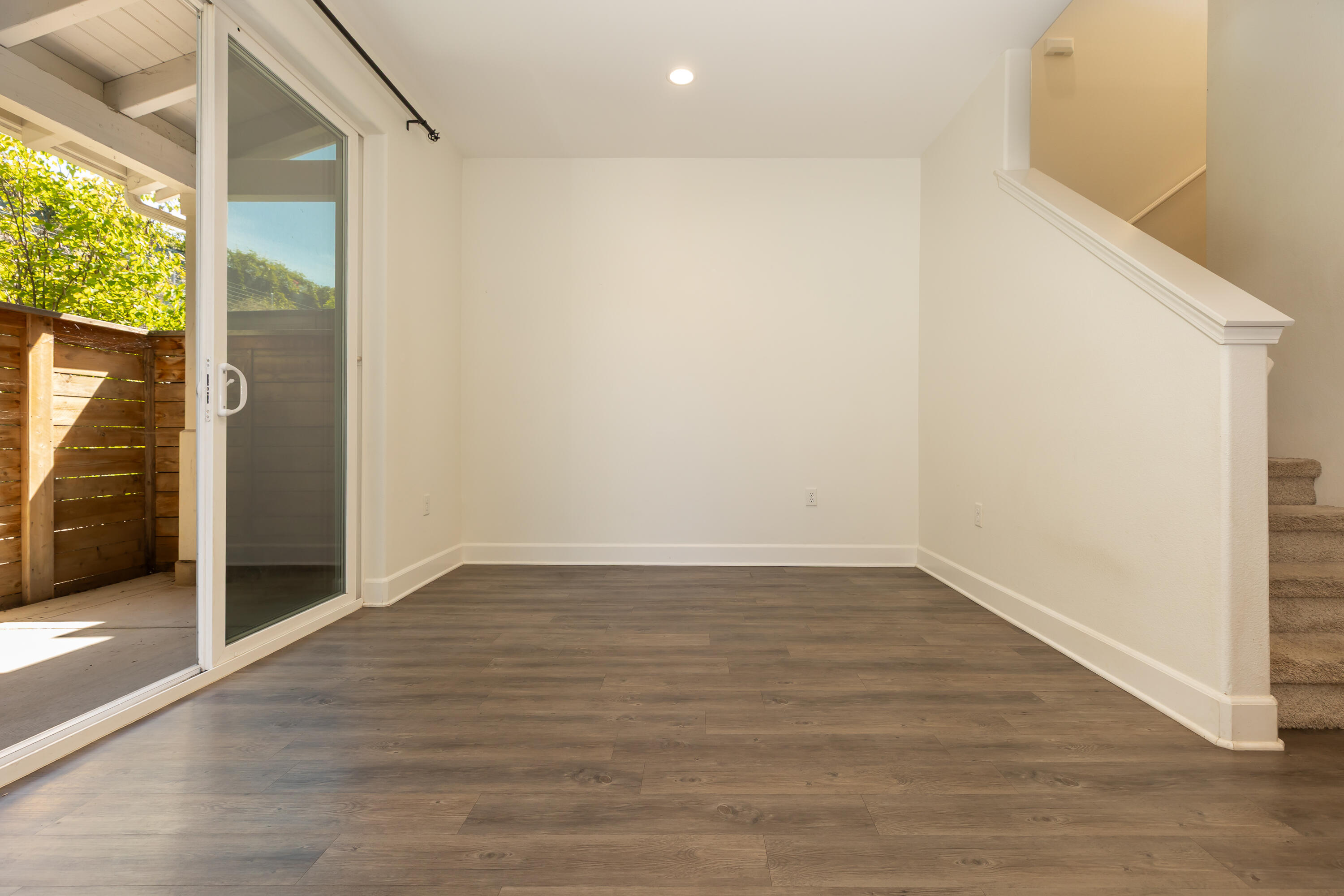 243 Deming Way Buellton, CA 93427 - Photo 4 of 28 a view of an empty room with wooden floor and a window