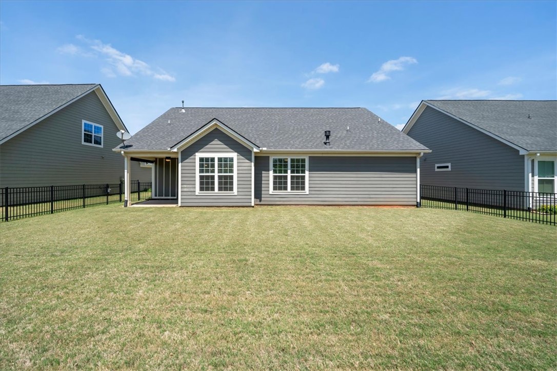 21 Barron Glenn Way Anderson, SC 29621 - Photo 47 of 48 This residential rear exterior showcases a well-maintained lawn and NEW privacy fence.