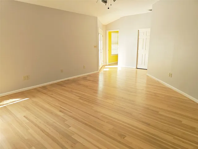 a view of a dining room with furniture and a potted plant