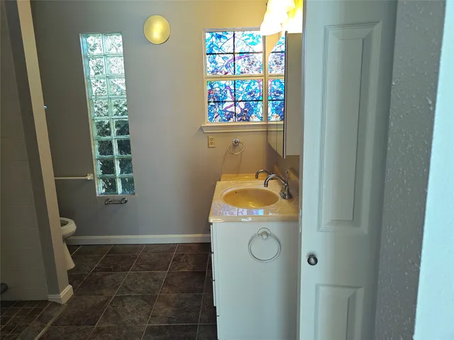 a view of staircase with wooden floor and white walls