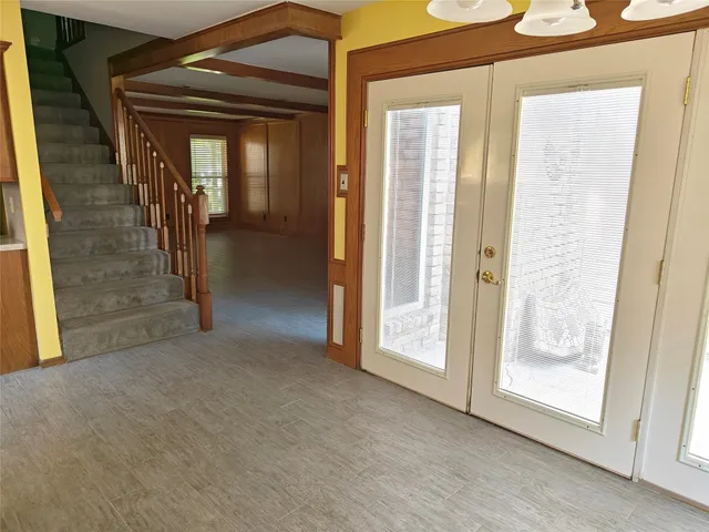 a white toilet sitting next to a bathroom sink