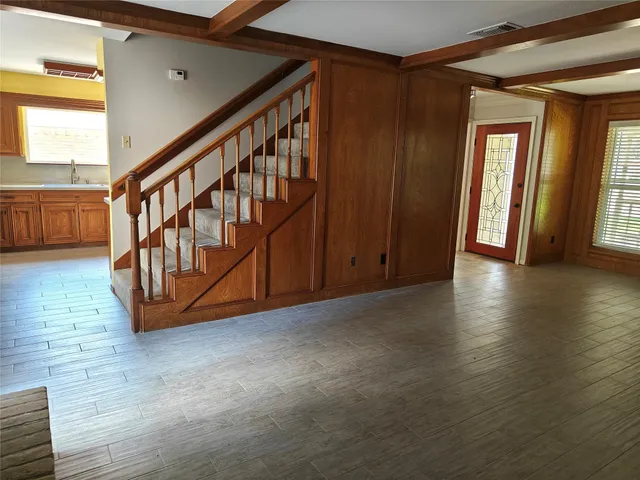 a view of a livingroom with workspace and a couch