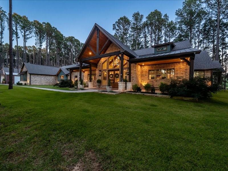 8595 Toler Pointe Larue, TX 75770 - Photo 2 of 40 Long one-story ranch is 130' long Rustic Modern Ranch home nestled in 2 acres of pine trees and sits on a small bass fishing lake.