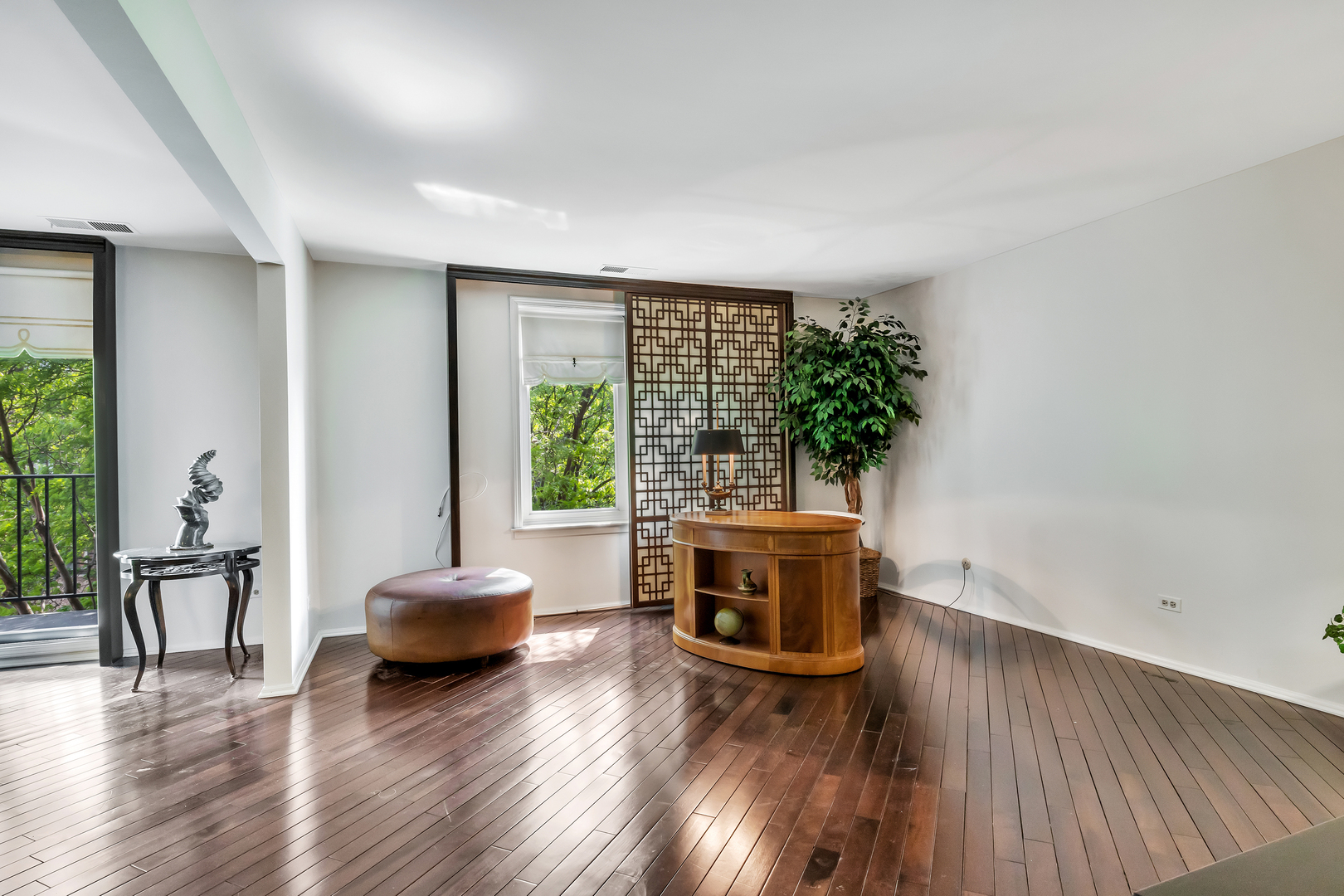 9560 Gross Point Road, Unit 509B Skokie, IL 60076 - Photo 12 of 41 a living room with furniture and a wooden floor