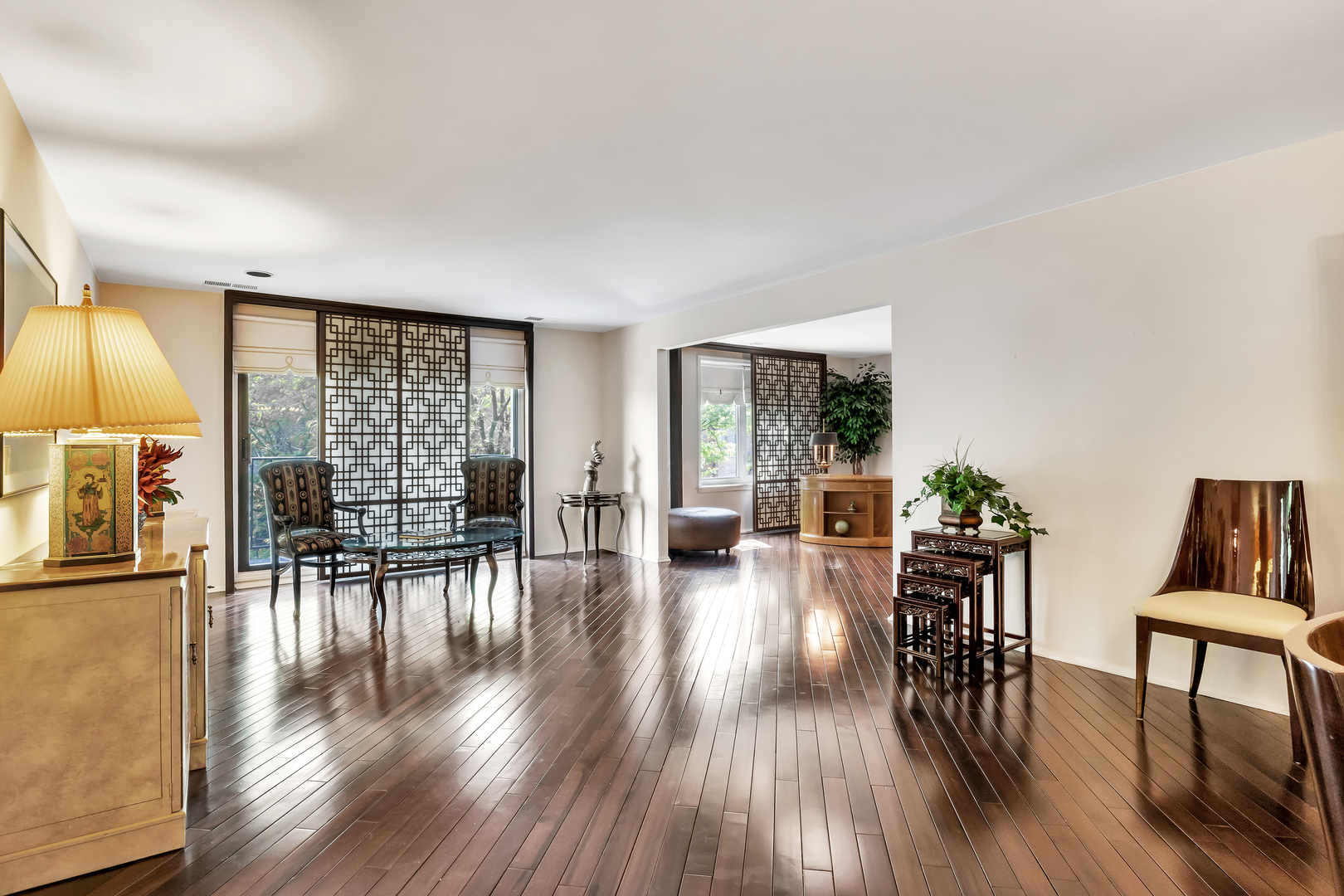 9560 Gross Point Road, Unit 509B Skokie, IL 60076 - Photo 14 of 41 a living room with furniture and wooden floor