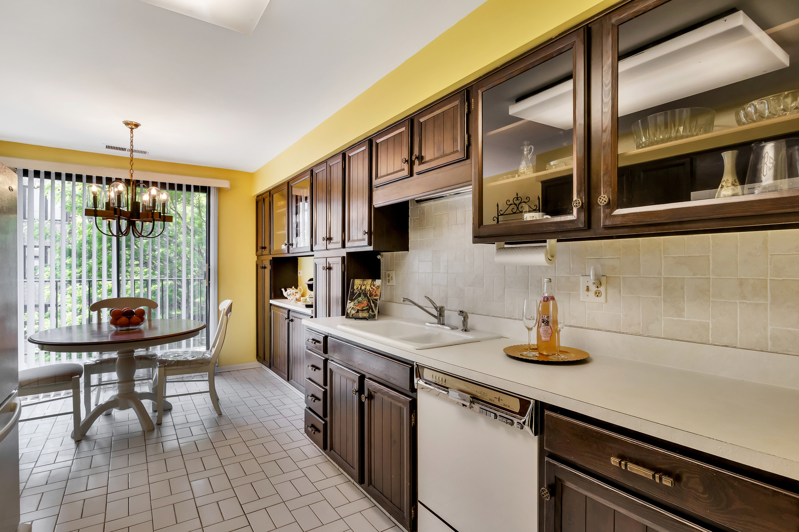 9560 Gross Point Road, Unit 509B Skokie, IL 60076 - Photo 16 of 41 a kitchen with stainless steel appliances a sink and cabinets