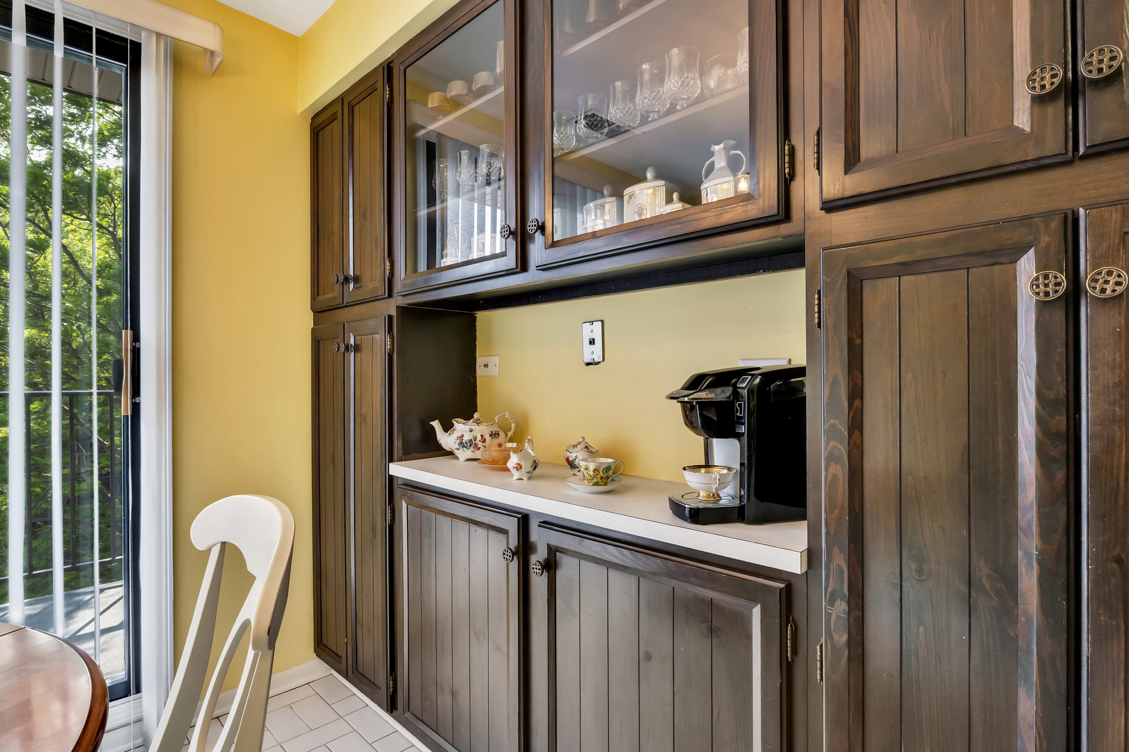 9560 Gross Point Road, Unit 509B Skokie, IL 60076 - Photo 18 of 41 a kitchen with stainless steel appliances granite countertop a refrigerator and a wooden cabinets
