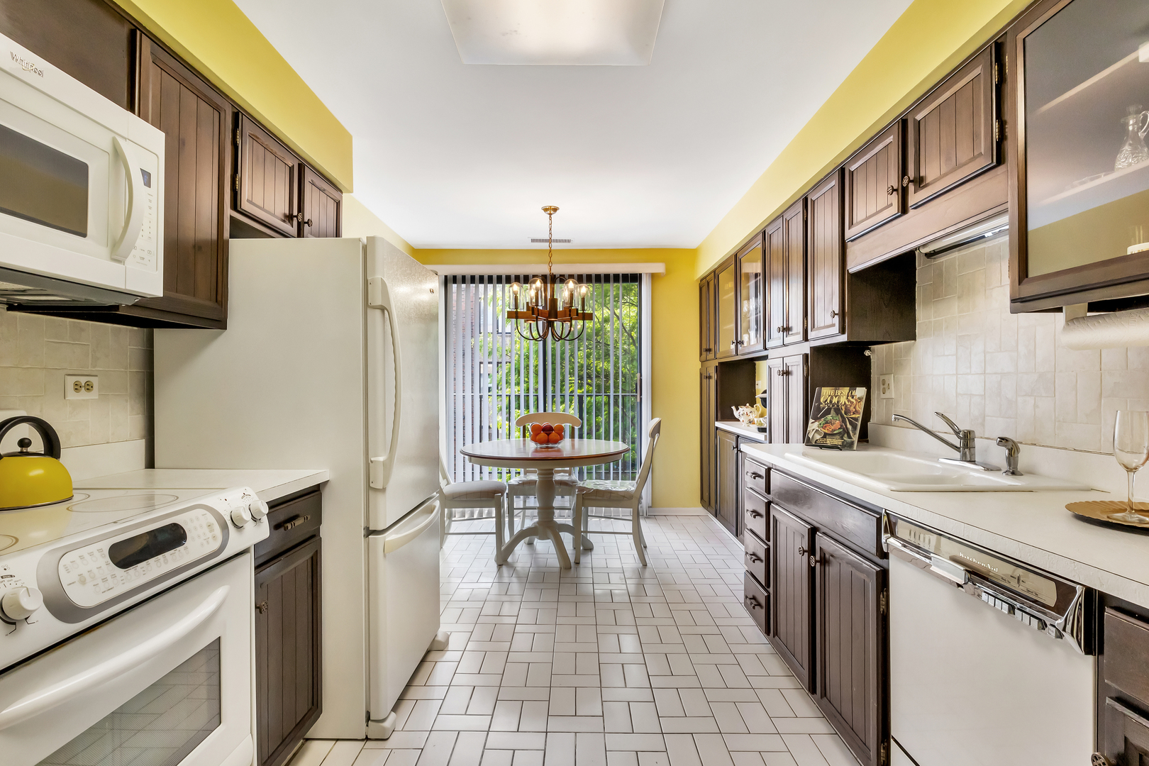 9560 Gross Point Road, Unit 509B Skokie, IL 60076 - Photo 19 of 41 a kitchen with a sink appliances and cabinets