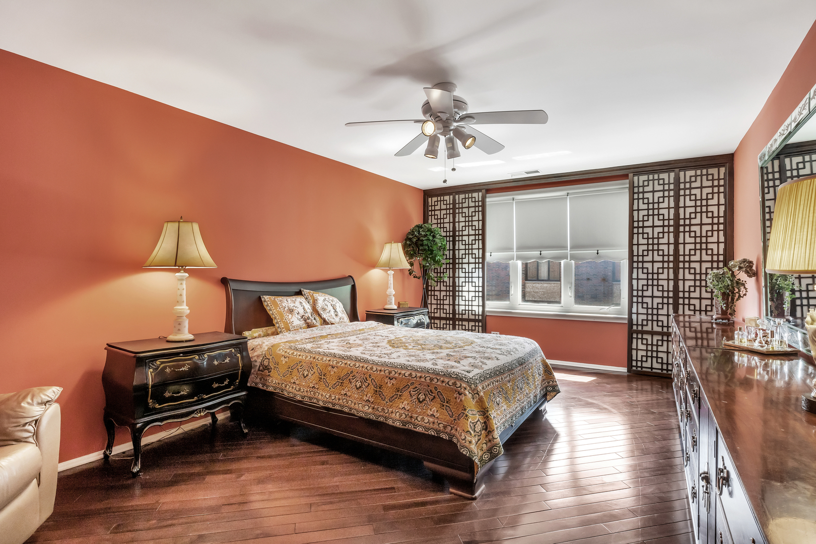 9560 Gross Point Road, Unit 509B Skokie, IL 60076 - Photo 21 of 41 a bedroom with a bed a chandelier and large window