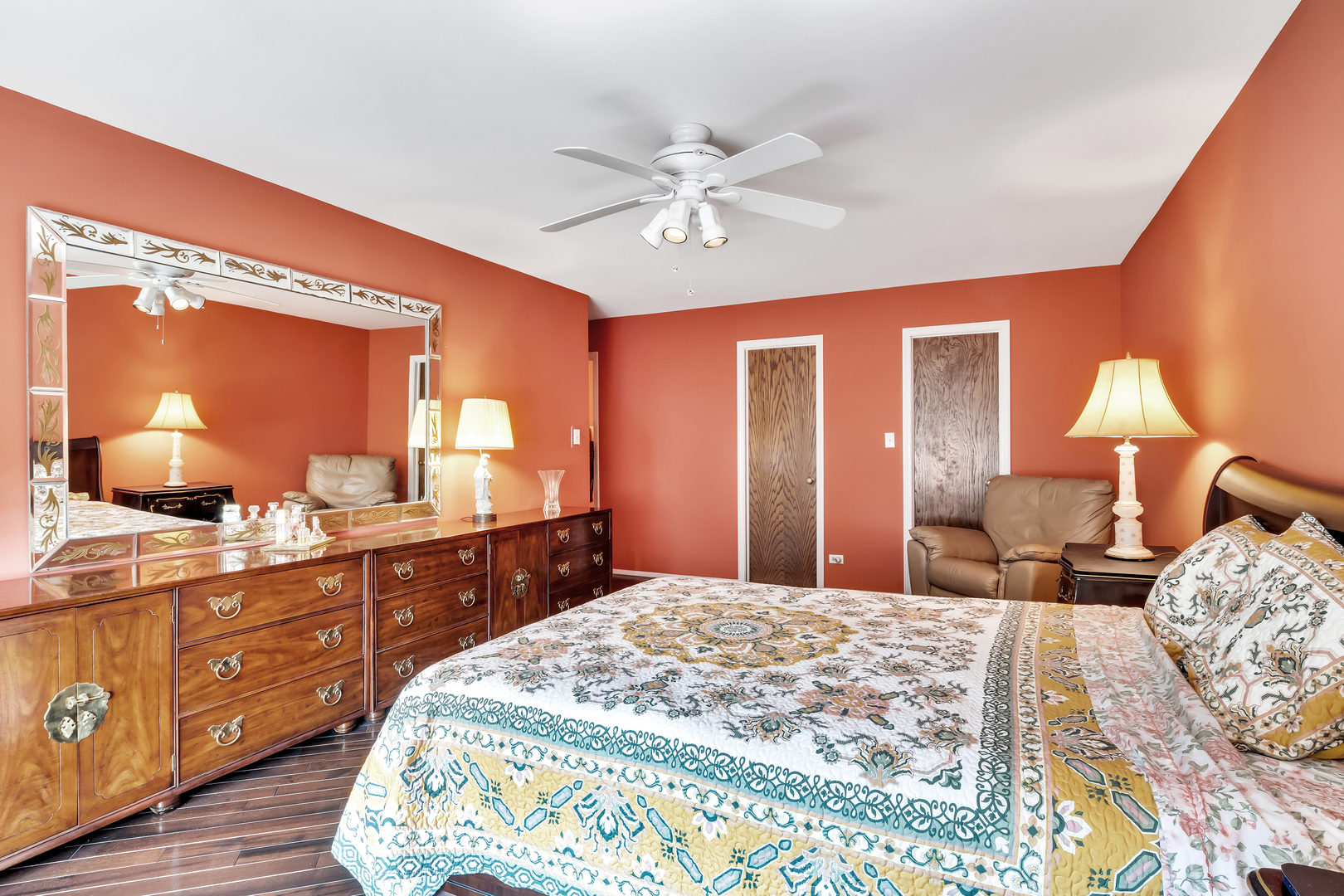 9560 Gross Point Road, Unit 509B Skokie, IL 60076 - Photo 23 of 41 a bedroom with a bed and a mirror on dresser