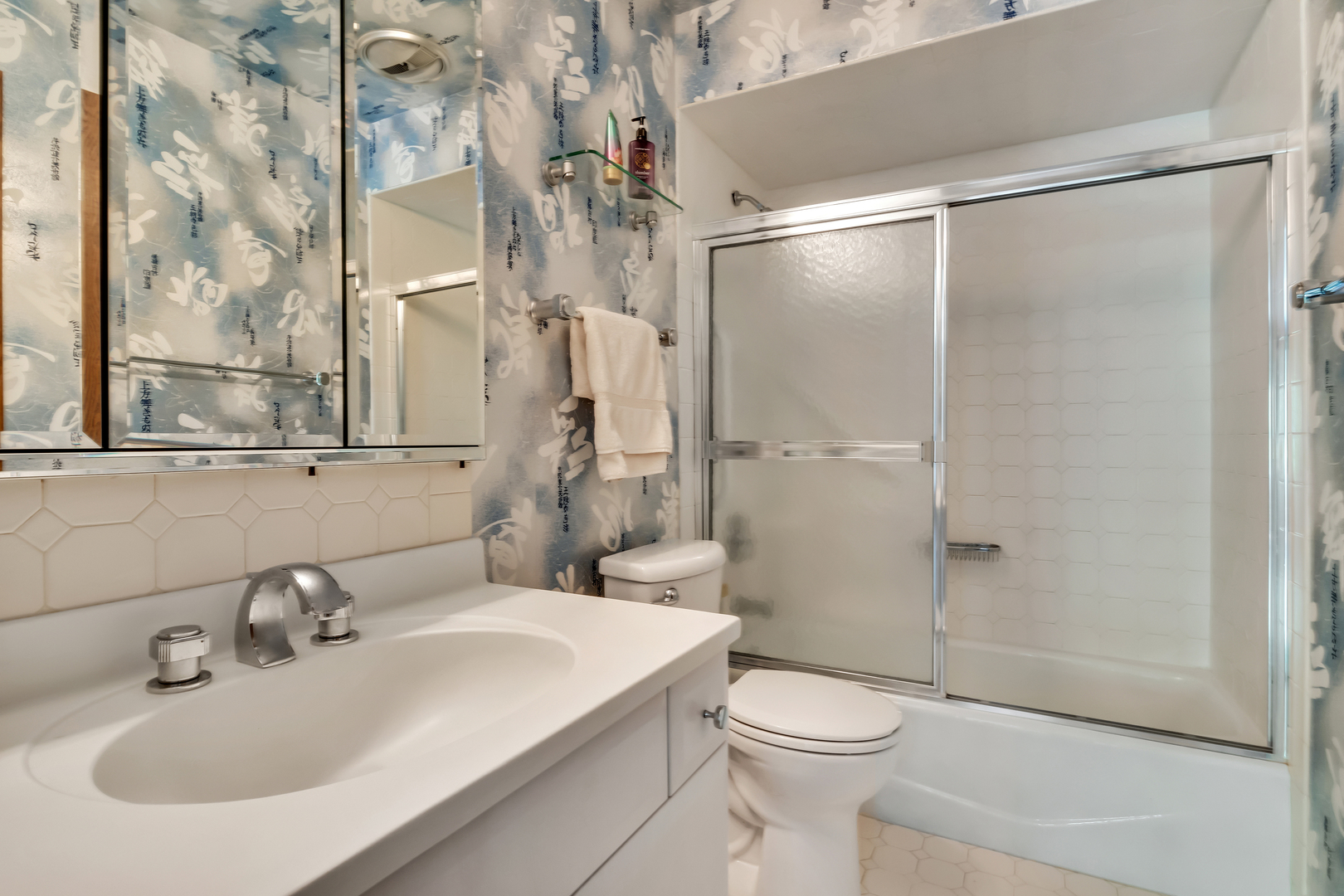 9560 Gross Point Road, Unit 509B Skokie, IL 60076 - Photo 27 of 41 a bathroom with a sink toilet and shower