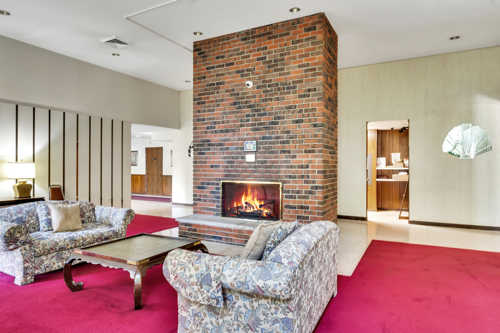 9560 Gross Point Road, Unit 509B Skokie, IL 60076 - Photo 31 of 41 a living room with furniture and a fireplace