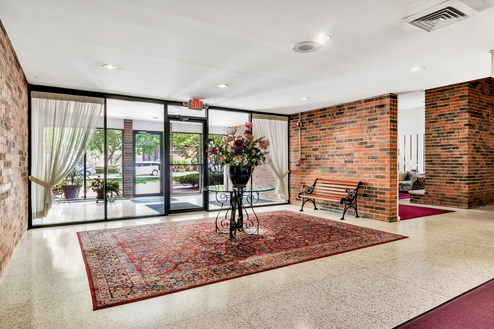 9560 Gross Point Road, Unit 509B Skokie, IL 60076 - Photo 33 of 41 a living room with furniture and floor to ceiling window