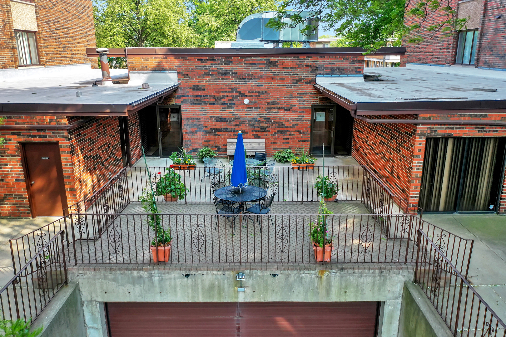 9560 Gross Point Road, Unit 509B Skokie, IL 60076 - Photo 37 of 41 an outdoor view of house with outdoor seating
