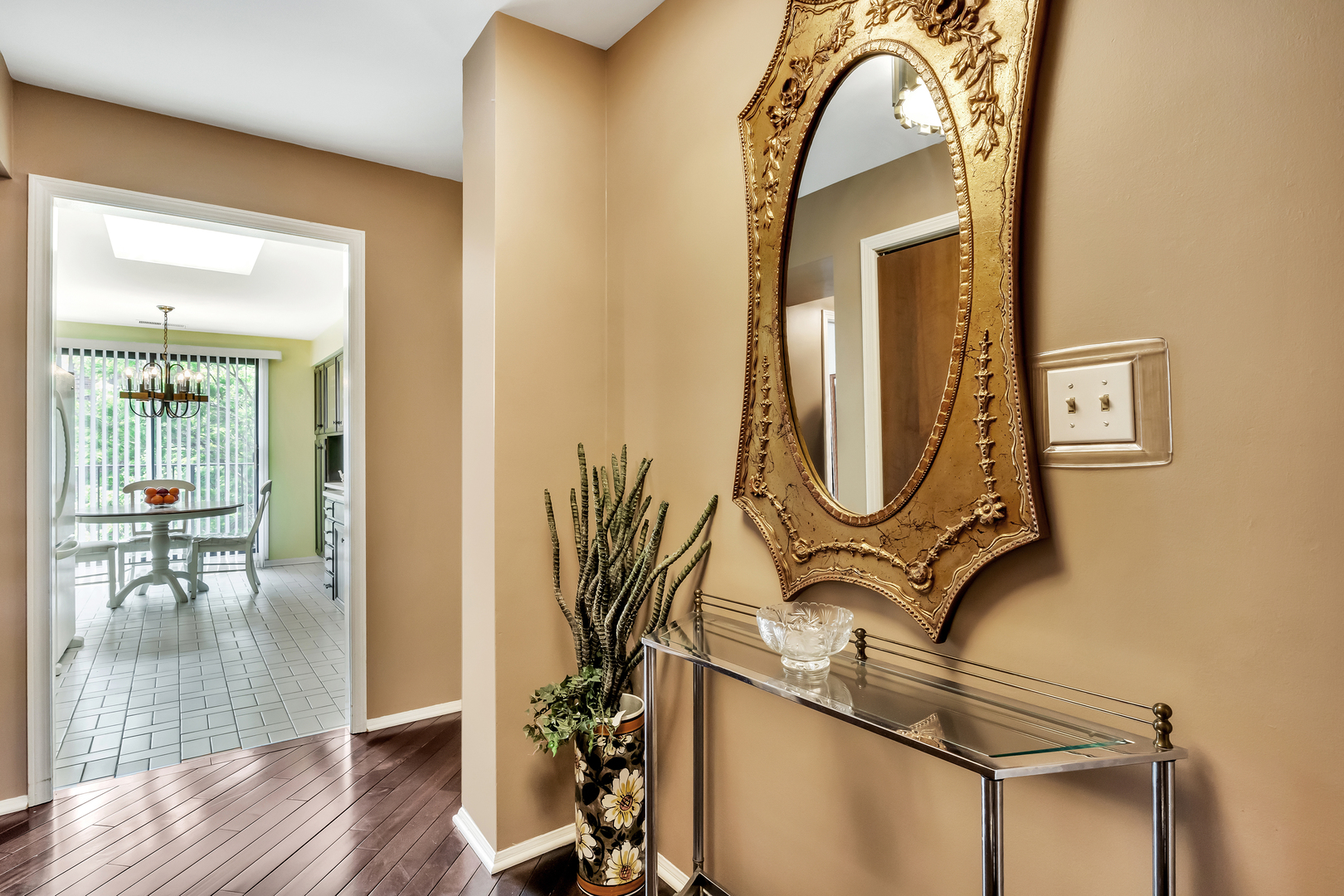 9560 Gross Point Road, Unit 509B Skokie, IL 60076 - Photo 4 of 41 a view of staircase with wooden floor and a mirror
