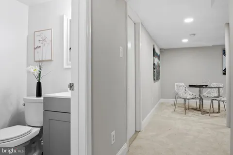 a bathroom with a toilet and a sink