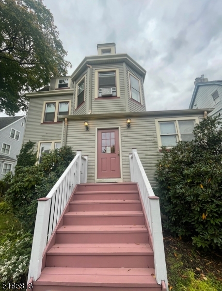 180 Bellevue Avenue Montclair, NJ 07043 - Photo 1 of 13 a view of a house with more windows and flower plants