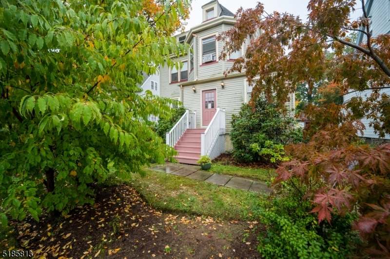 180 Bellevue Avenue Montclair, NJ 07043 - Photo 2 of 13 a view of a house with a yard and plants