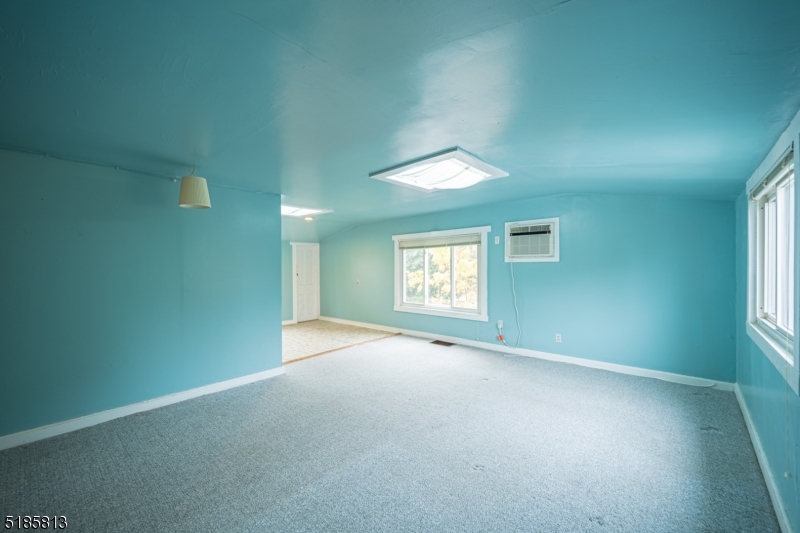 180 Bellevue Avenue Montclair, NJ 07043 - Photo 3 of 13 an empty room with a empty space and windows